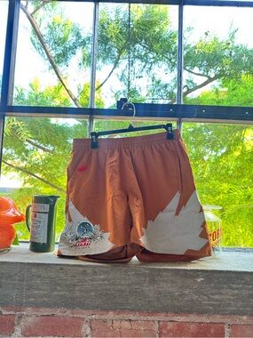 Travis Scott Rust Orange Graphic Athletic Shorts with White Accents
